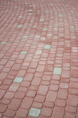 Fototapeta premium Texture of red floor paving tiles in city - background
