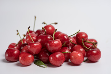 Bunch of fresh cherries on white