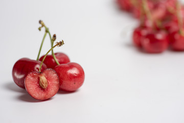 Bunch of fresh cherries on white