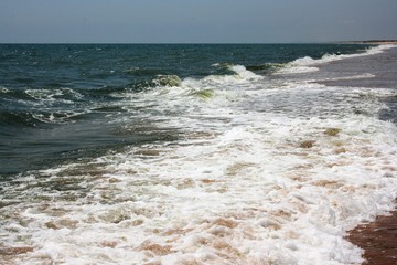 clear water with waves and blue sky