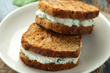 Fototapeta na wymiar Ricotta cheese spinach sandwich with coffee. healthy breakfast