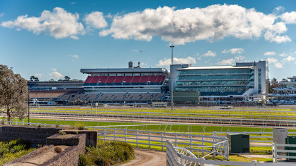 The Flemington Racecourse grandstands in front of the Maribynong River in Melbourne, Australia - obrazy, fototapety, plakaty