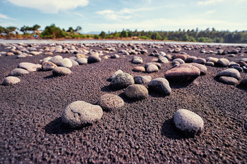 Pebble on the black san beach.