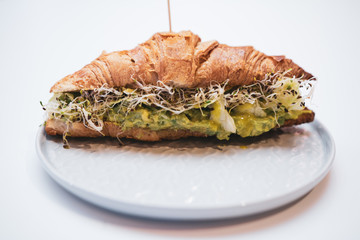 sandwich of goukomole on a white background
