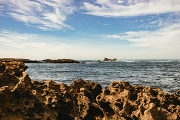 Fototapeta na wymiar Interesting eroded rocks on the coast in Essaouira