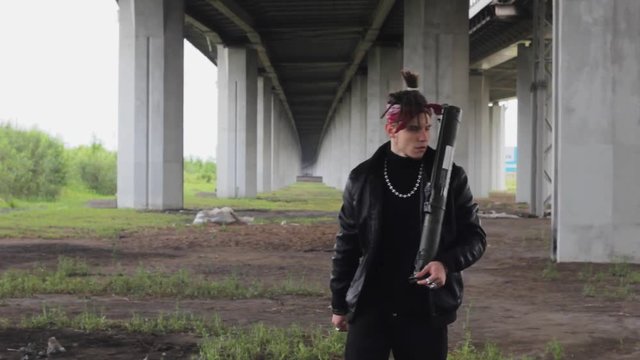 gangster threatens with weapon bazooka   armed  attack aggressive
