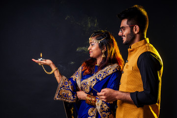 indian female and hindu man celebration divali studio background