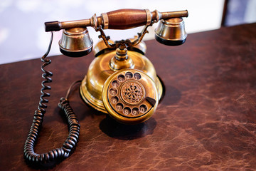 Old fashioned telephone on table.