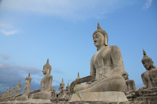 Buddha face in blue sky background, Buddha statue in Thailand.