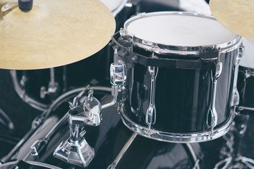 Black drum set. Drummer equipment.