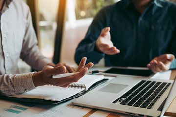 Two businessmen are talking about the wrong financial budget of the company and the correct analysis.