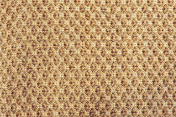 Fototapeta premium Closeup of beige knitted material