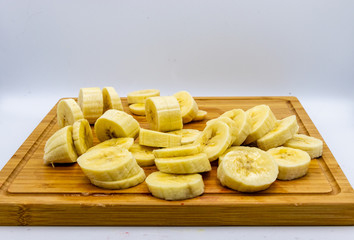 Bananas on a wooden cutting board. Calgary, alberta, Canada