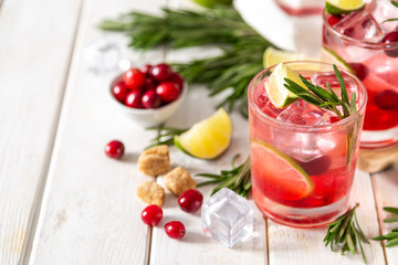 Cold season drink - cranberry and rosemary cocktail, copy space