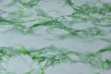 Green and white marble background.