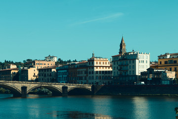 Florence, Italy - old European city. Quay, bridge, architecture. Summer day.
