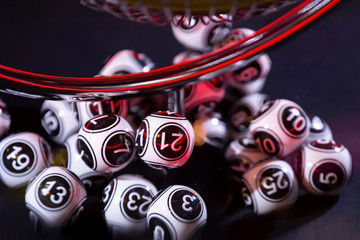 Black and white lottery balls in a machine 21