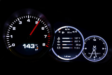 Modern light car mileage on black background