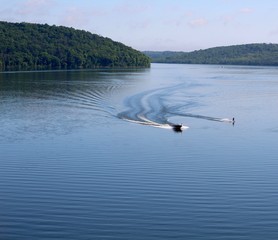 A boating day at the lake in the park on a sunny spring day.