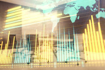 Double exposure of stock market graph with globe hologram on conference room background. Concept of international finance