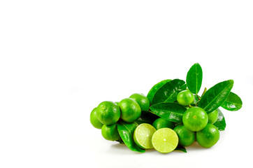 Seedless organic lime fruits (Citrus aurantifolia) isolated on white background.