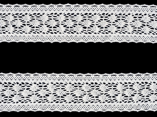 White laces on black background. Lacework concept