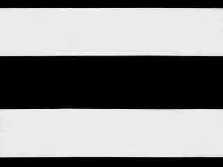 White ribbon on black background. Concept sewing still life