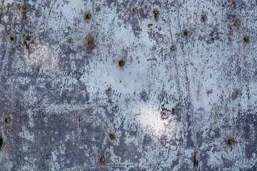 Metal fence covered in paper and glue with interesting texture