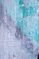 Metal fence covered in paper and glue with interesting texture