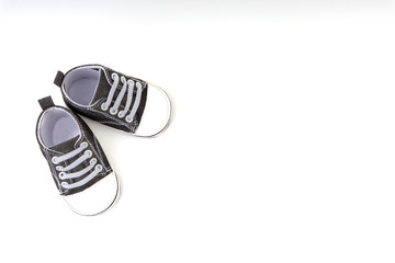 Baby shoes on white background. Selective focus