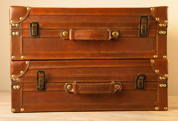 Two Leather Suitcases Stacked One on the Top of Other