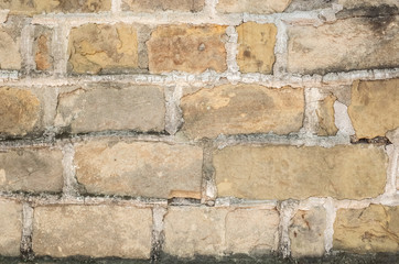 aged yellow brick wall