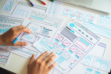 Website designer Creative planning application developer development draft sketch drawing template layout prototype framework wireframe design studio . User experience concept .