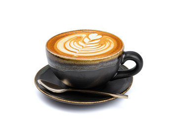 Side view of hot latte coffee with latte art in a vintage matt black cup and saucer isolated on white background with clipping path inside.