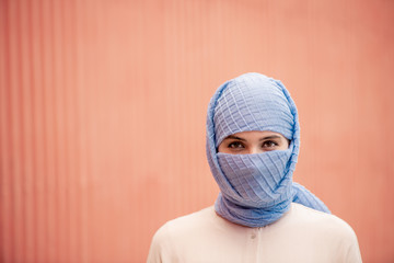 Head and shoulders of young Islamic female in hijab