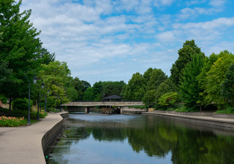 Fototapeta na wymiar Bridge in the Distance along the Naperville Riverwalk