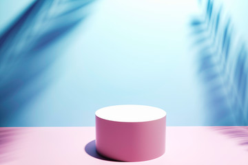 Blue circular product Stand in front of pink and blue background
