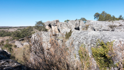 Natural place formed by vegetation and rocks with shapes caused by erosion
