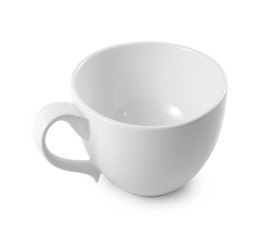 white ceramic cup on white background