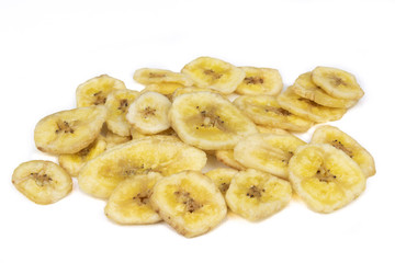 Dried banana pieces isolated on a white background.