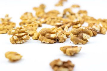  Walnuts peeled from the shell isolated on a white background.