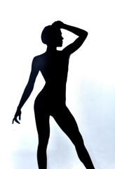 attractive shirtless slim girl's shadow, isolated white background, studio shot.