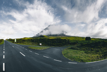 Straight EN3 longitudinal road northeast of Mount Pico and the silhouette of the Mount Pico along ,...