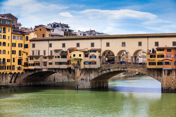 Fototapeta na wymiar Ponte Vecchio a medieval stone closed-spandrel segmental arch bridge over the Arno River in Florence