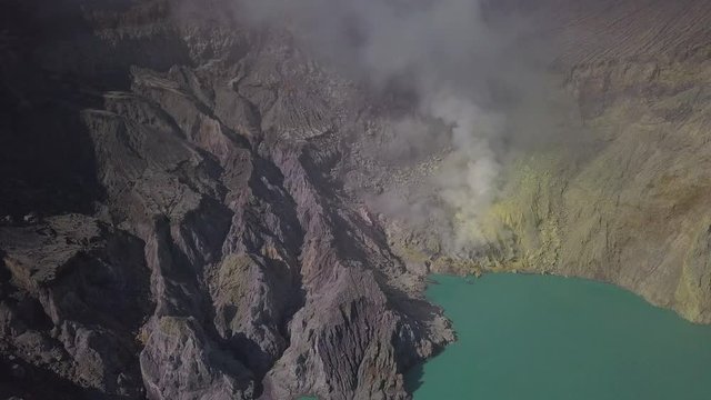 Aerial: Landscape view of Ijen volcano and lake. The most famous tourist attraction in Indonesia