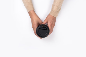 Female hand with paper cup isolated on white