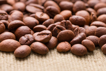Coffee beans close up. Scattered coffee beans.
