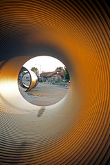 Logansport Train depot museum framed by large drainage tubes at the construction site of the...