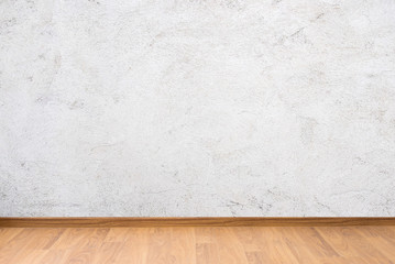 white cement wall texture and brown wooden floor