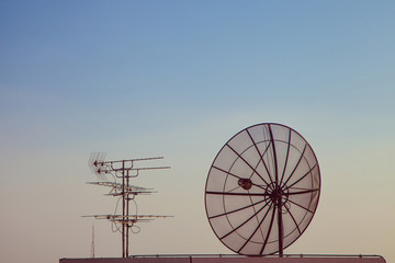 Satellite dish with old television receiver